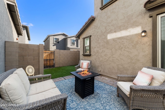 view of patio with a fire pit