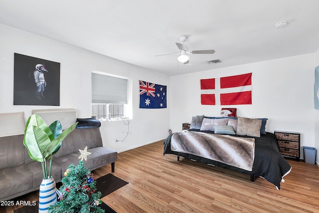 bedroom featuring hardwood / wood-style floors and ceiling fan