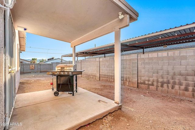 view of patio featuring a grill