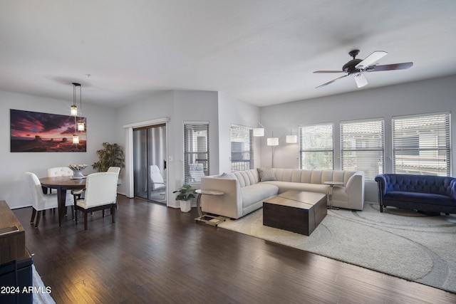 living room with wood finished floors and a ceiling fan