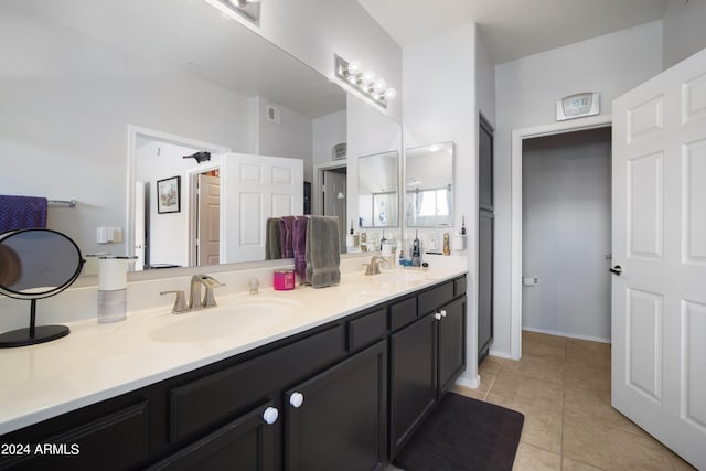 full bathroom with tile patterned flooring, visible vents, a sink, and double vanity