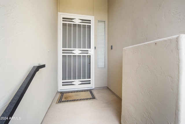 entrance to property with stucco siding