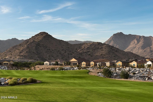 view of mountain feature with a residential view and golf course view