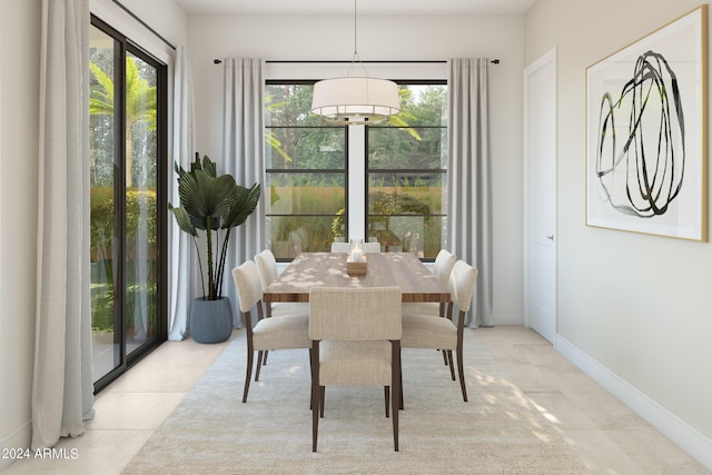 dining area with light tile patterned floors, baseboards, and a wealth of natural light