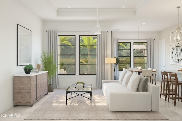 living area with recessed lighting, a raised ceiling, crown molding, and ceiling fan with notable chandelier