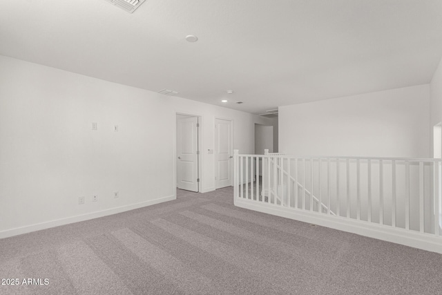 empty room featuring light colored carpet