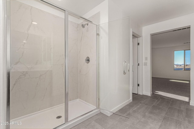 bathroom with a shower with shower door