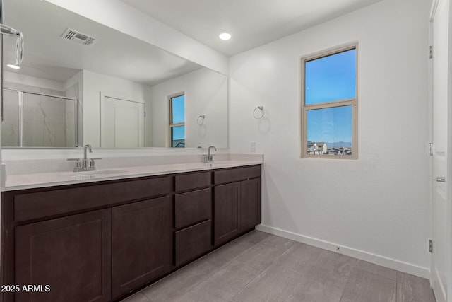 bathroom featuring vanity and walk in shower