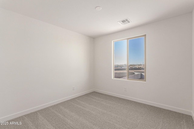 unfurnished room featuring carpet