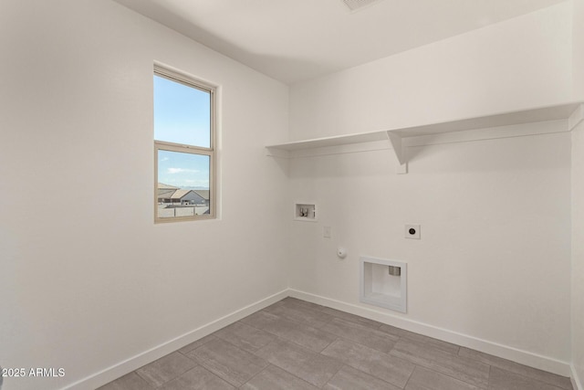 clothes washing area with electric dryer hookup, gas dryer hookup, and hookup for a washing machine