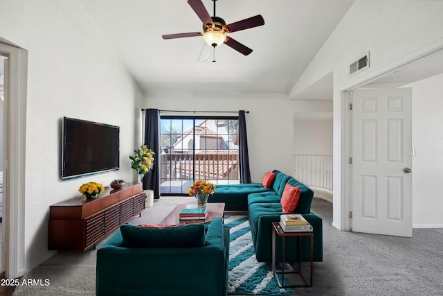 living room featuring lofted ceiling, carpet floors, ceiling fan, and visible vents