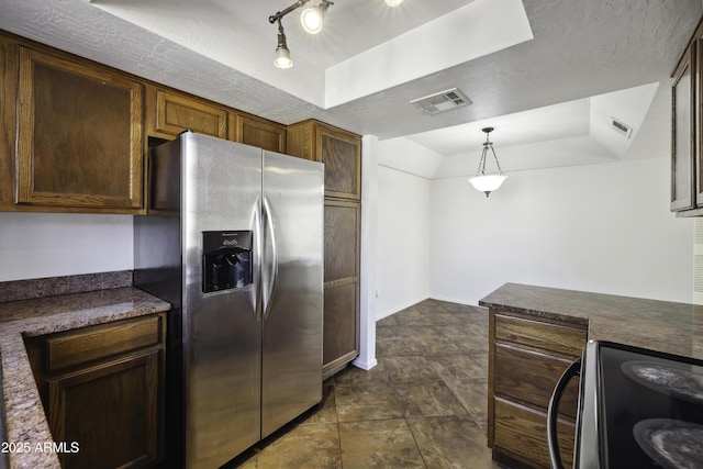 kitchen featuring black electric range oven, a raised ceiling, visible vents, and stainless steel fridge with ice dispenser