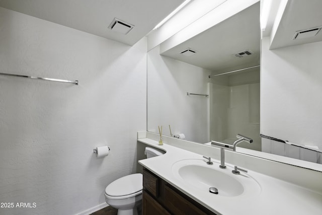 full bath with visible vents, vanity, and toilet