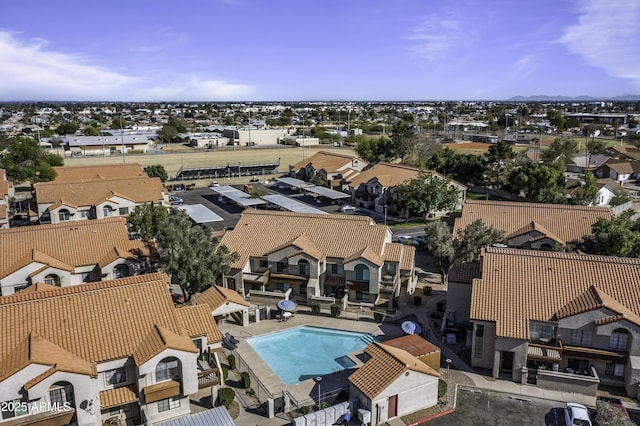 birds eye view of property with a residential view