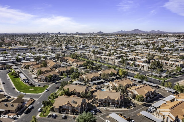 birds eye view of property with a residential view and a mountain view