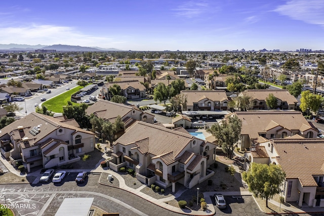 aerial view featuring a mountain view and a residential view