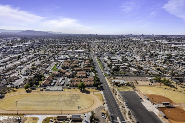 birds eye view of property with a mountain view