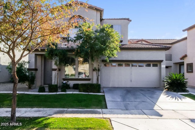 5329 E Harmony Ave, Mesa, AZ 85206 - view of front facade featuring a tiled roof, a garage, driveway, stucco siding, and a front lawn