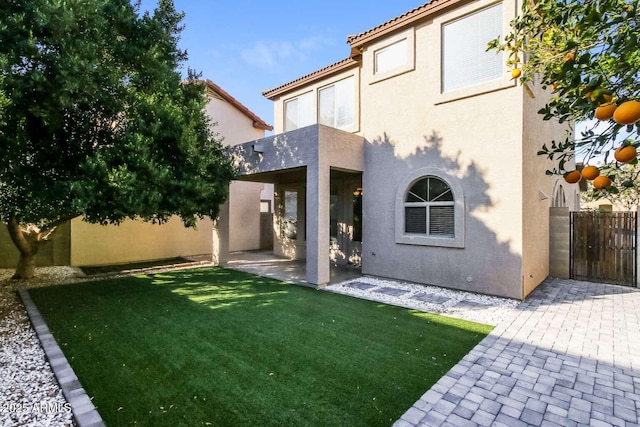 5329 E Harmony Ave, Mesa, AZ 85206 - back of property with stucco siding, a patio, and a tiled roof