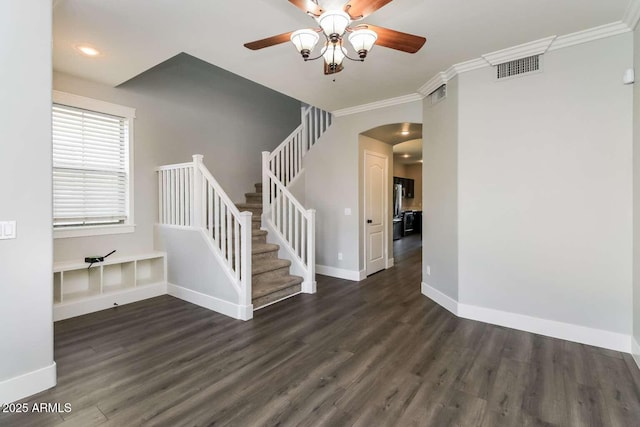 5329 E Harmony Ave, Mesa, AZ 85206 - staircase featuring arched walkways, wood finished floors, ceiling fan, crown molding, and baseboards
