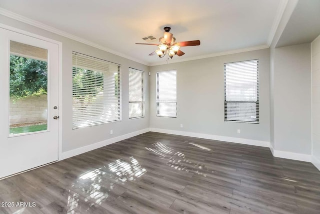 5329 E Harmony Ave, Mesa, AZ 85206 - empty room with healthy amount of natural light, ceiling fan, ornamental molding, wood finished floors, and baseboards