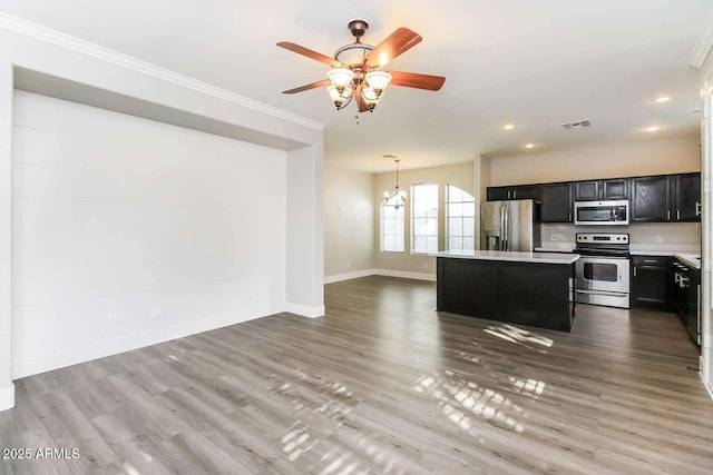 5329 E Harmony Ave, Mesa, AZ 85206 - kitchen with stainless steel appliances, dark cabinets, light countertops, baseboards, and ceiling fan
