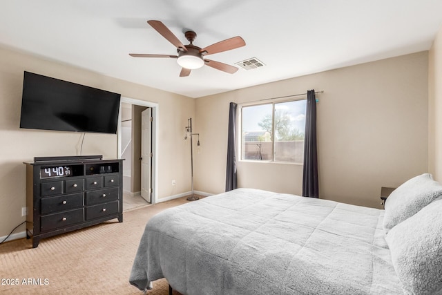 carpeted bedroom featuring visible vents, ceiling fan, and baseboards