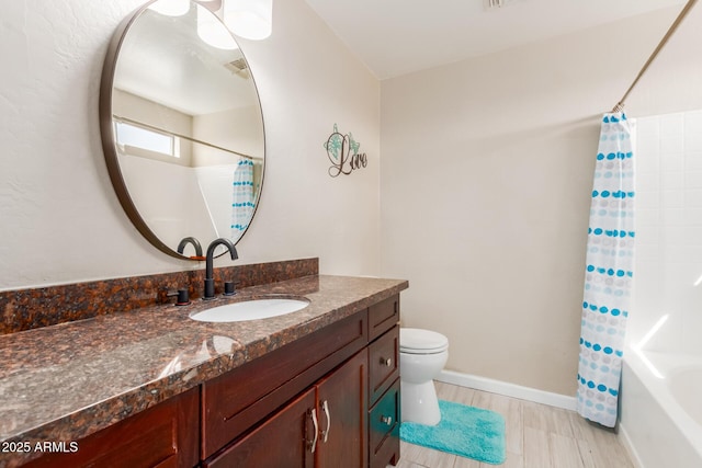 bathroom with shower / tub combo with curtain, visible vents, toilet, vanity, and baseboards