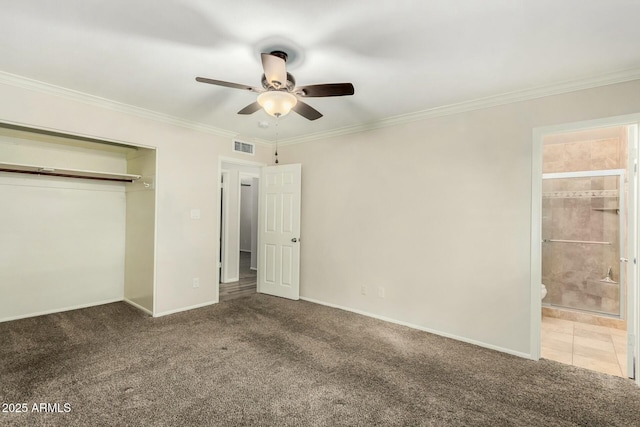 unfurnished bedroom featuring baseboards, visible vents, ornamental molding, a closet, and carpet flooring