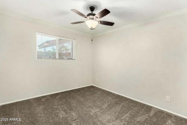 empty room with crown molding, baseboards, dark carpet, and ceiling fan