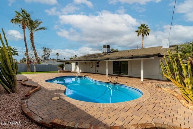 view of pool featuring a patio, central air condition unit, a fenced backyard, and a fenced in pool