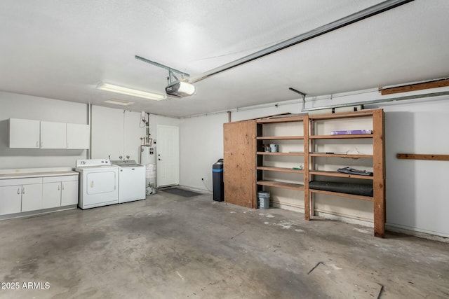 garage featuring a garage door opener, washing machine and dryer, and water heater