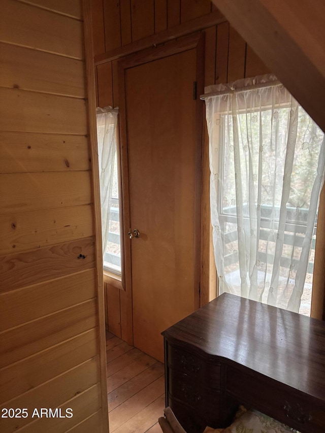 3994 N Mohawk St, Pine, AZ 85544 - corridor with wood walls and light wood-style floors