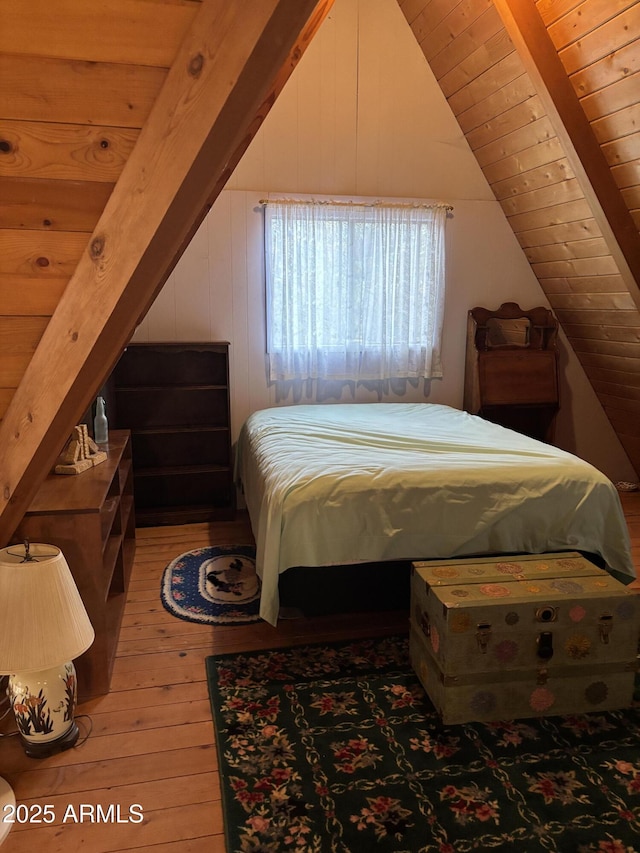 3994 N Mohawk St, Pine, AZ 85544 - bedroom featuring light wood-style floors, vaulted ceiling, and wooden walls