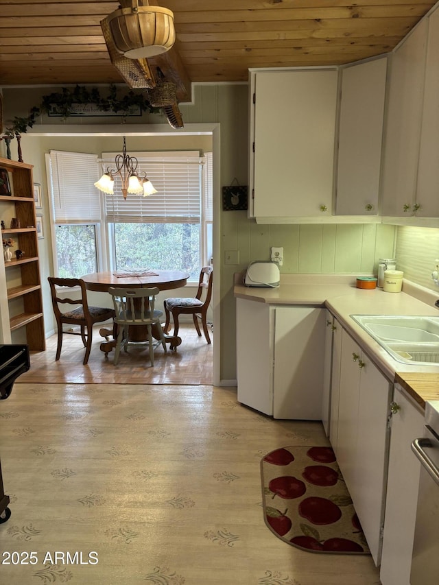 3994 N Mohawk St, Pine, AZ 85544 - kitchen featuring wood ceiling, light countertops, white cabinetry, a chandelier, and light wood-style floors