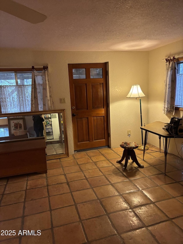 3994 N Mohawk St, Pine, AZ 85544 - entryway with a textured ceiling, light tile patterned floors, and a textured wall