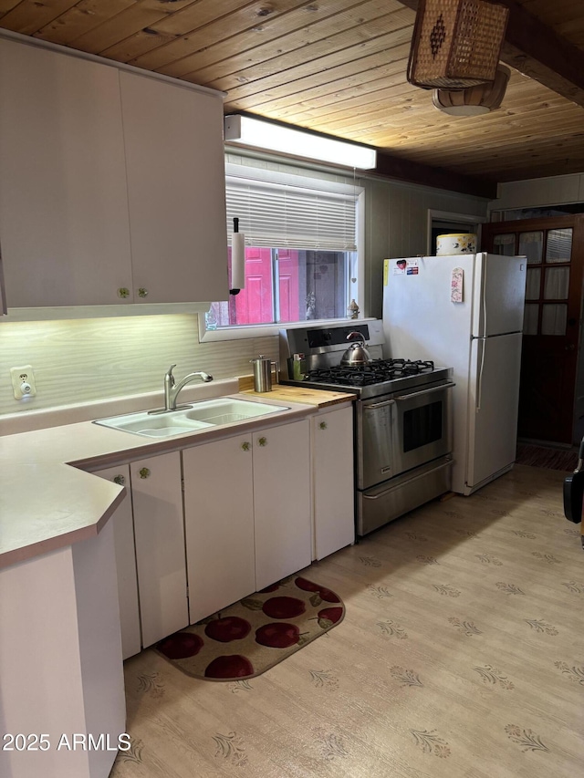 3994 N Mohawk St, Pine, AZ 85544 - kitchen featuring wooden ceiling, gas stove, a sink, light wood finished floors, and white cabinets