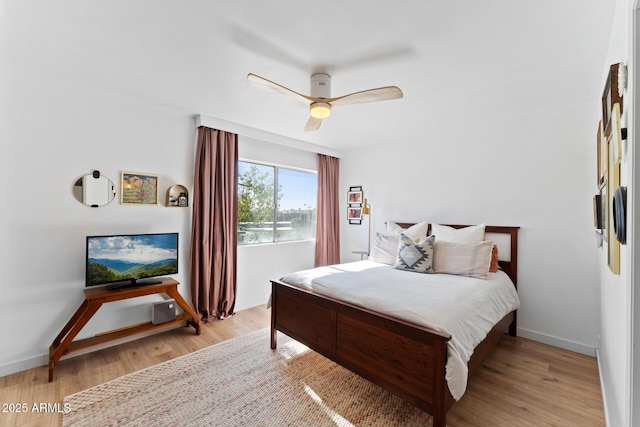 bedroom featuring light wood-type flooring and ceiling fan