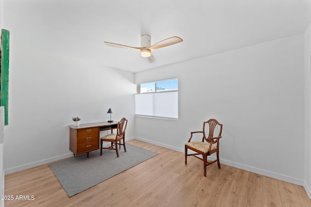 office with ceiling fan and light hardwood / wood-style floors