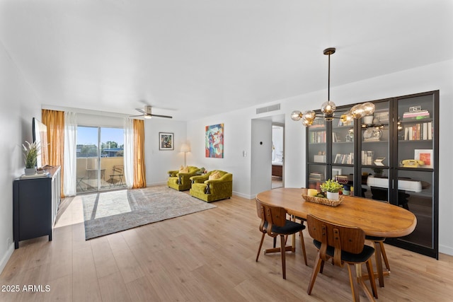 dining area featuring ceiling fan and light hardwood / wood-style flooring