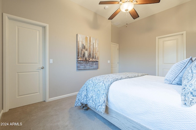 bedroom featuring light colored carpet and ceiling fan