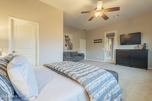 bedroom featuring light colored carpet and ceiling fan