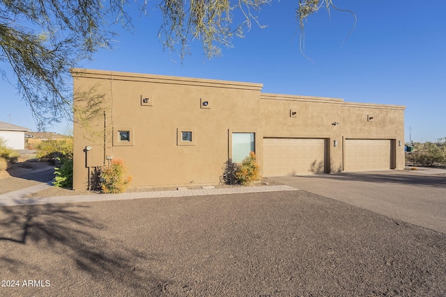 view of property exterior with a garage