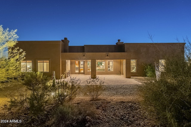 back of house featuring a patio area