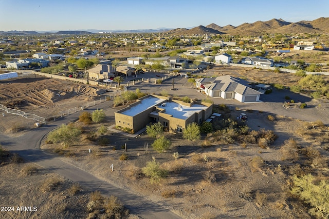 birds eye view of property featuring a mountain view