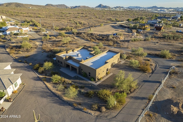 birds eye view of property with a mountain view