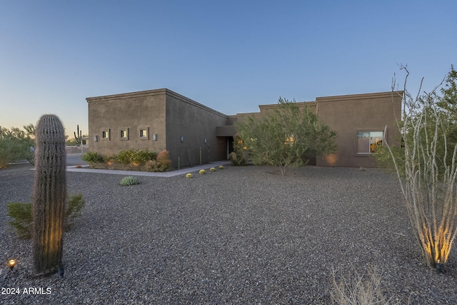 view of property exterior at dusk