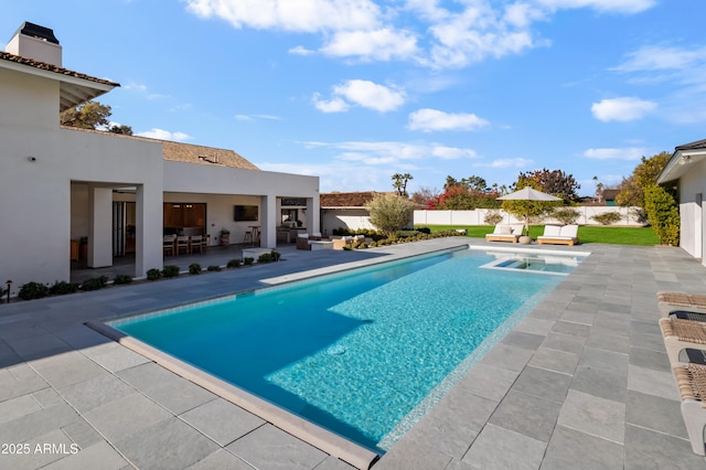 view of swimming pool featuring a patio area