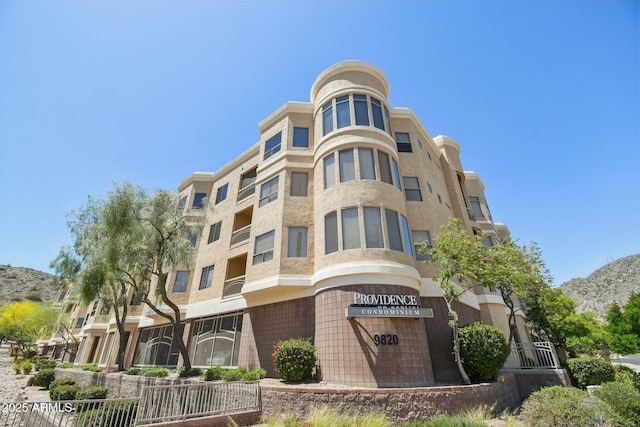 view of building exterior featuring a mountain view