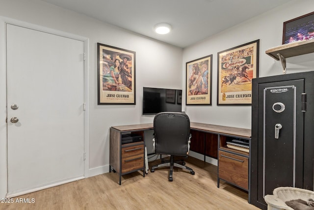 home office featuring baseboards and light wood-style floors